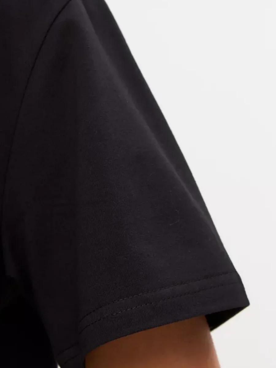 Реальное фото Футболка DEN.VER женская (кулирка) оверсайз, принт 2 ромашки черная ФМ-1-003 от магазина Спортев